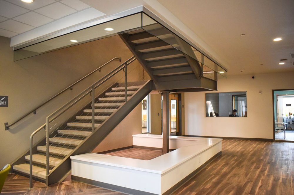 Stairs leading from the first floor of Hope Village to the second floor.